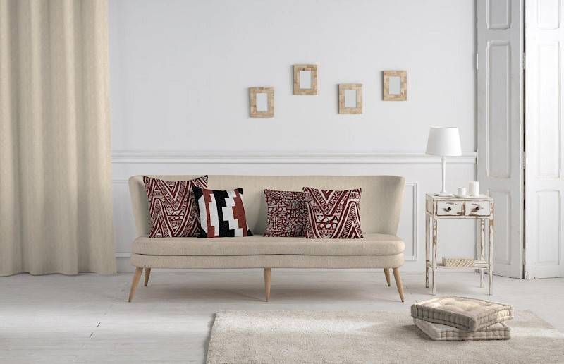 pillows in Boho Chic style on bench in minimalist living room